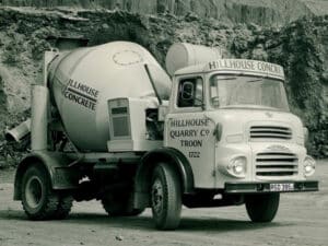 Vintage Hillhouse Quarry cement mixer truck in an industrial quarry setting.
