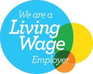 Circular logo with overlapping blue, green, yellow, orange circles, text "We are a Living Wage Employer"